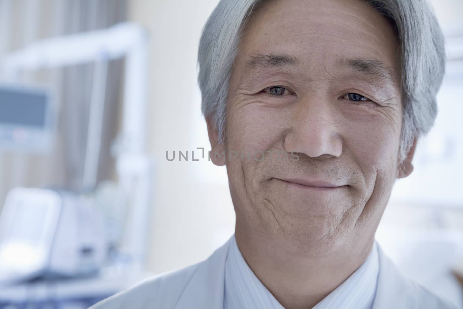 Close-up portrait of mature male doctor in the hospital