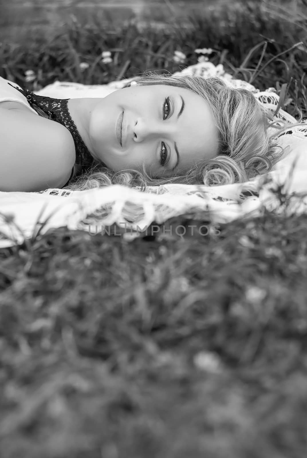 Beautiful girl relaxing on the grass by doble.d