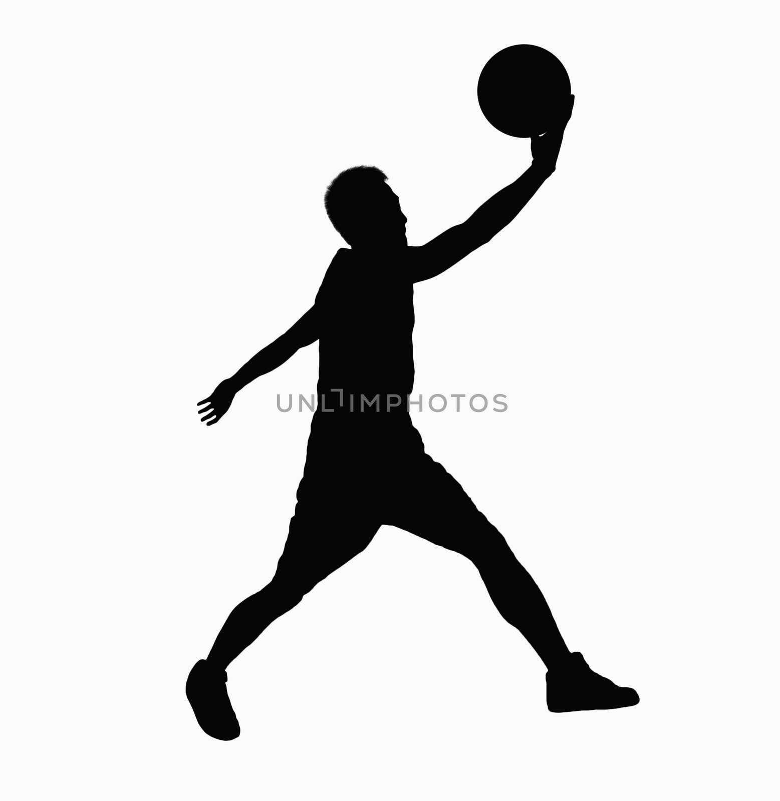 Silhouette of basketball player jumping with ball.