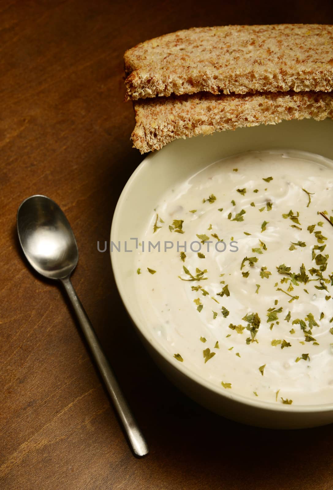 cream of mushroom soup on a wooden table in autumn by ftlaudgirl