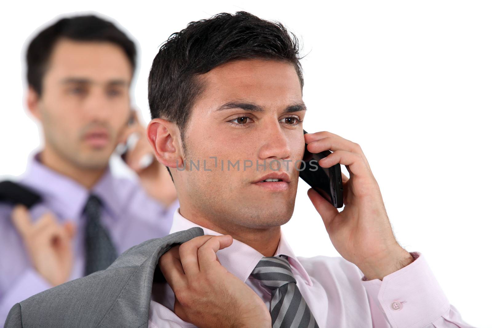 businessmen talking on their cell phone