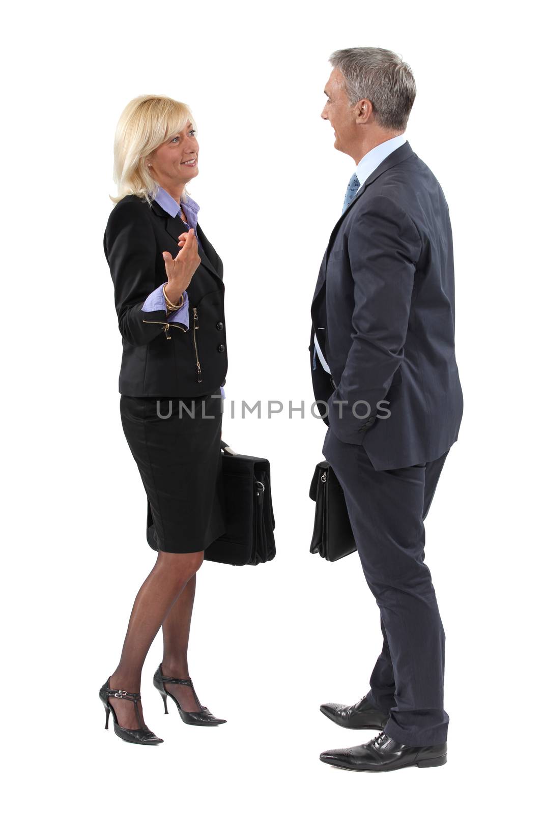 Businesspeople making small talk by phovoir
