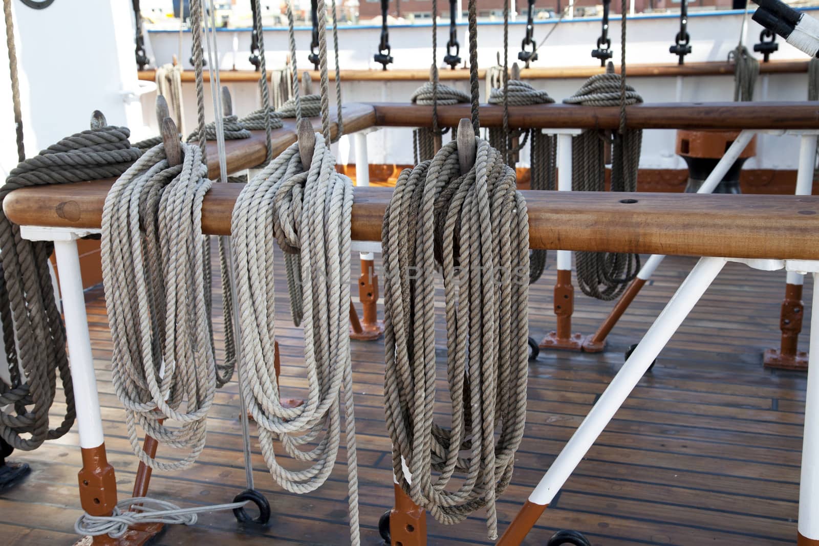 Sailboat wooden marine rigs and ropes. Nautical traditional tackle 