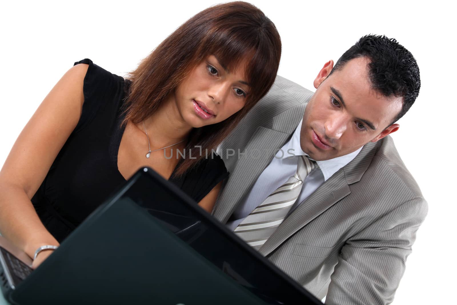 Business couple with laptop by phovoir