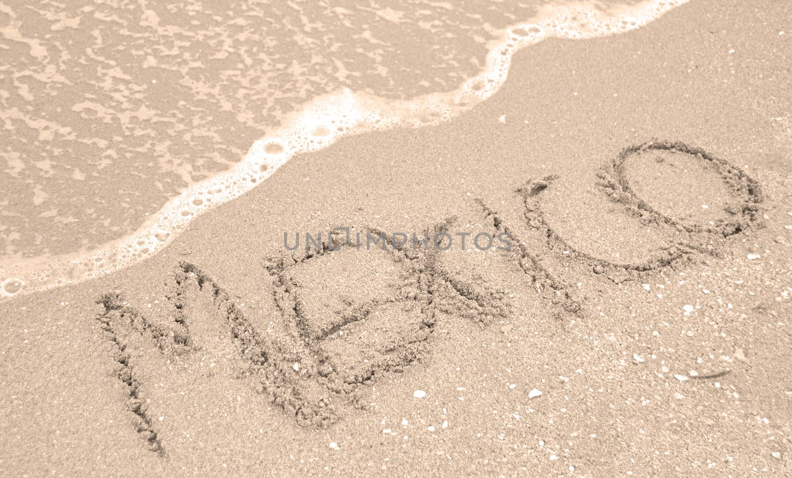 Mexico written in the sand 