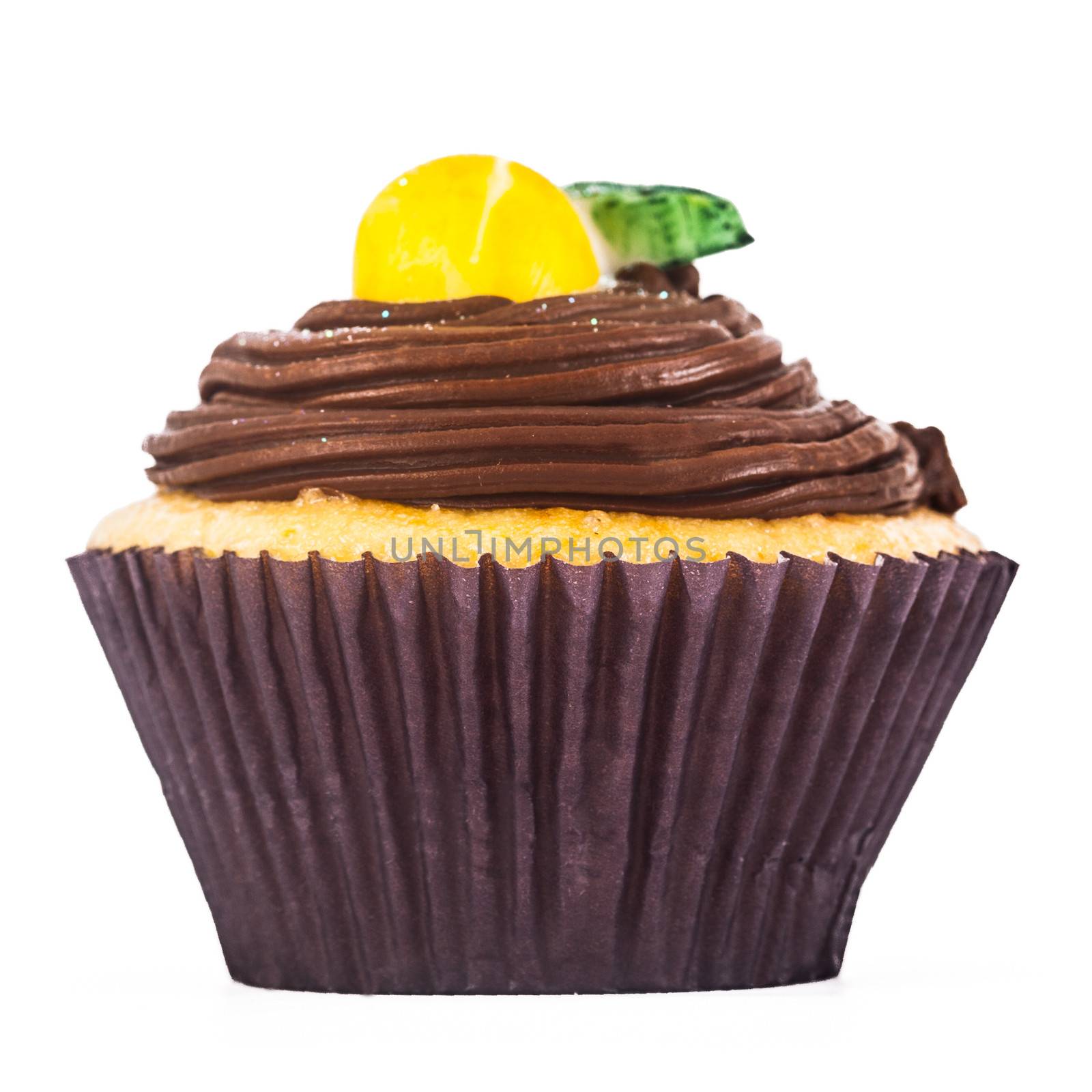 A gorgeous and delicious chocolate and lemon cupcake isolated on a white background.