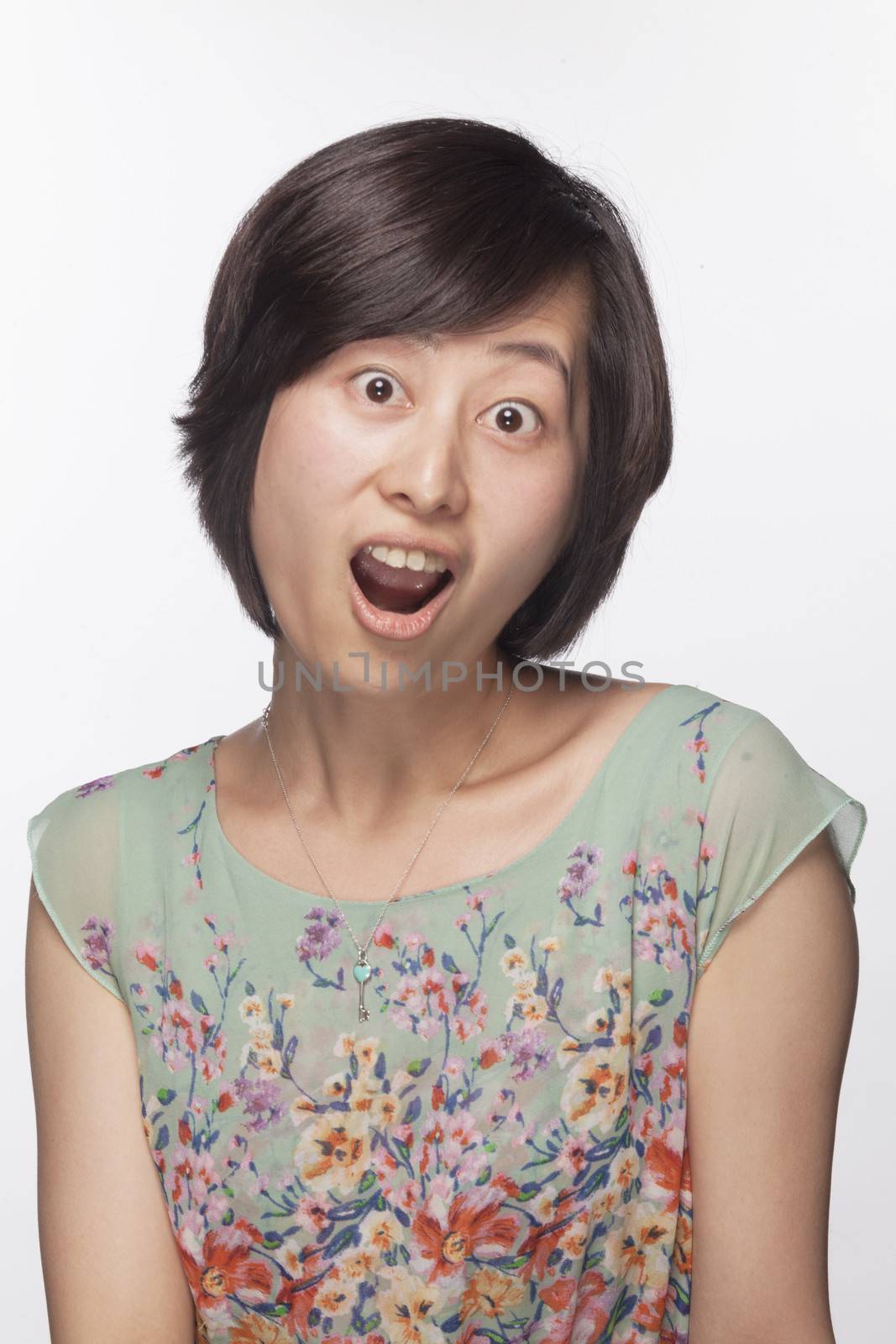 Portrait of surprised and shocked woman, studio shot by XiXinXing