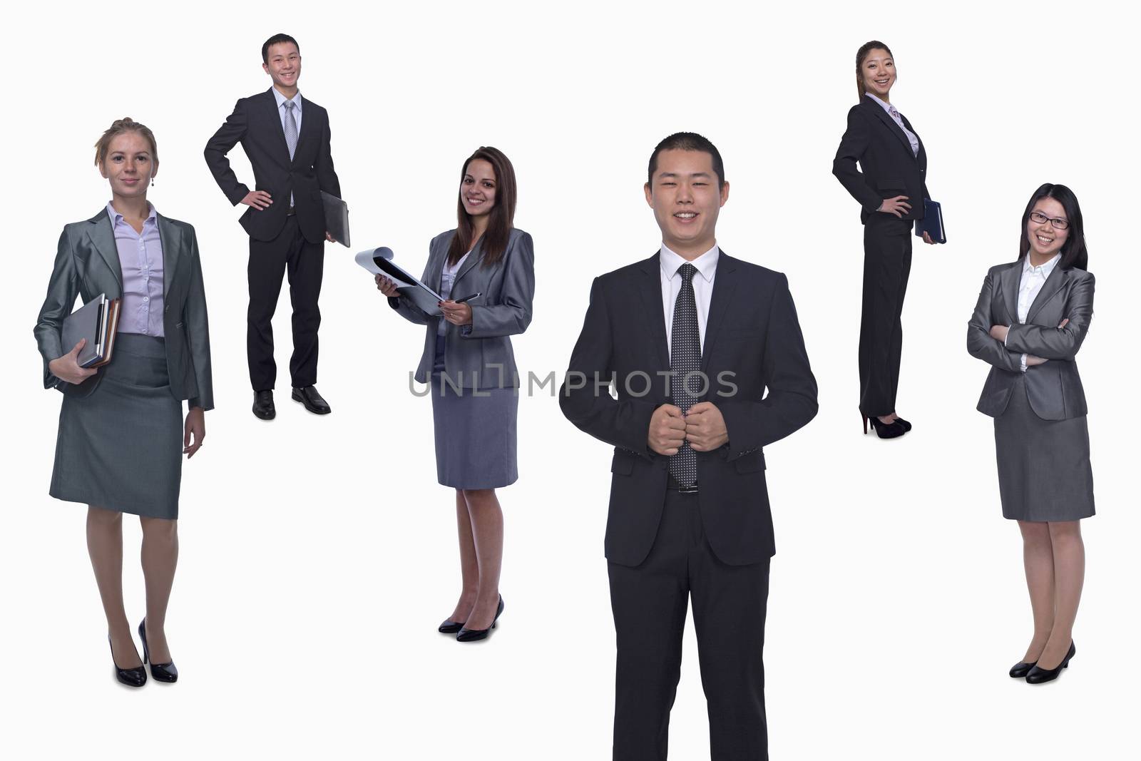 Medium group of smiling business people, portrait, full length, studio shot