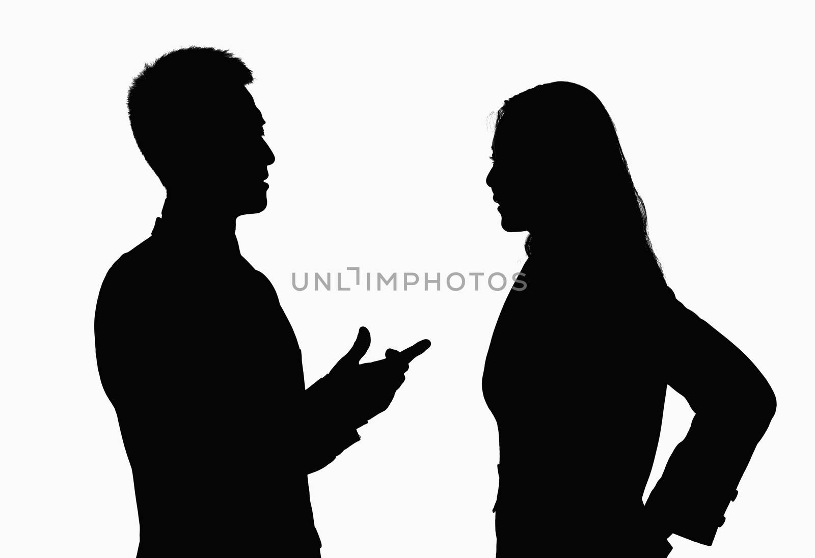 Silhouette of businessman and businesswoman talking. by XiXinXing