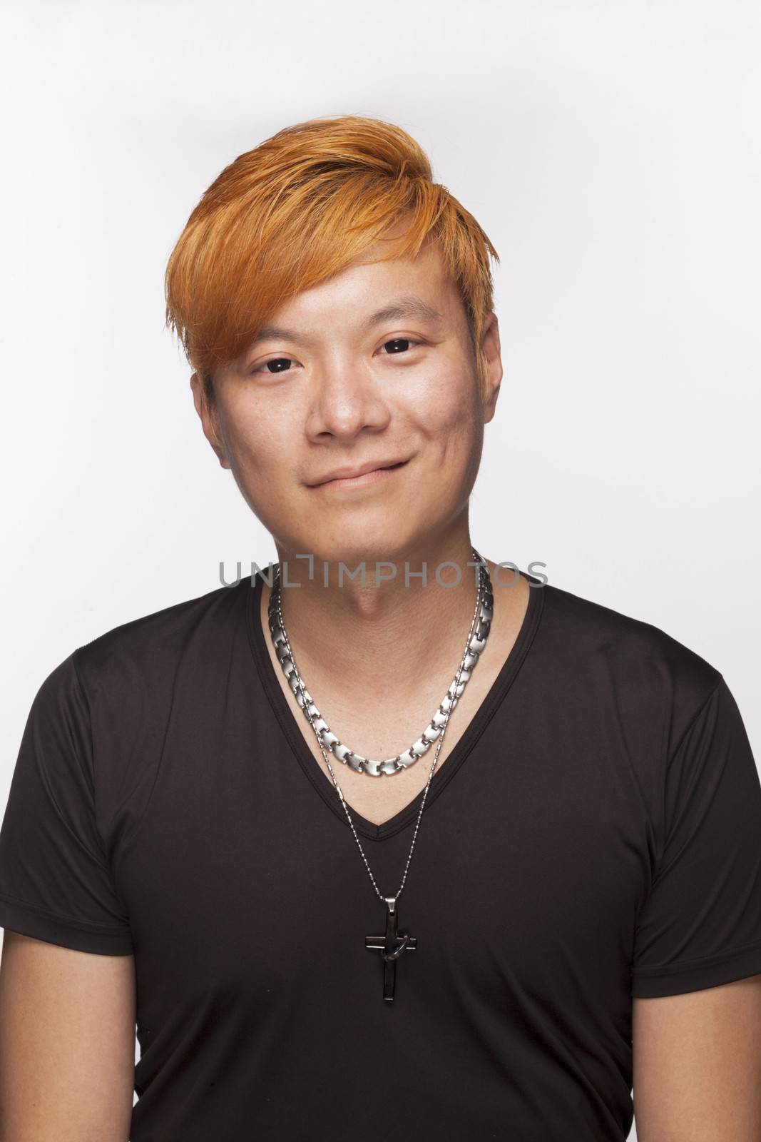 Portrait of smiling young man with orange hair 