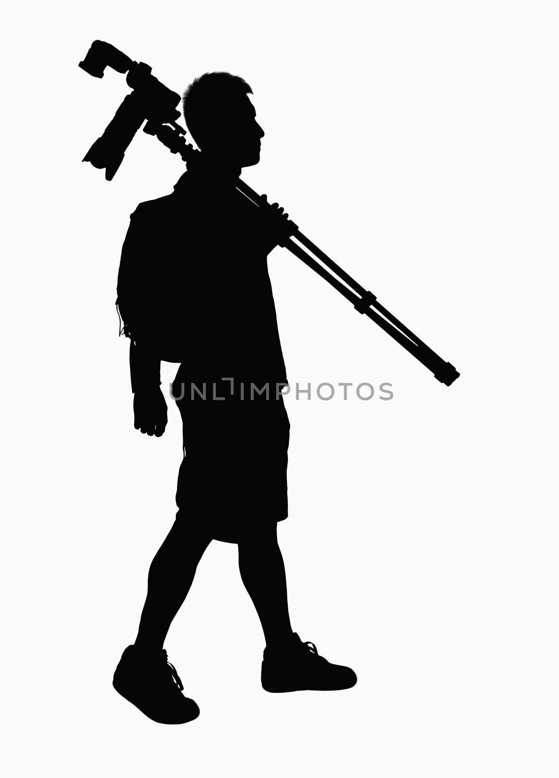 Silhouette of man carrying camera and tripod.
