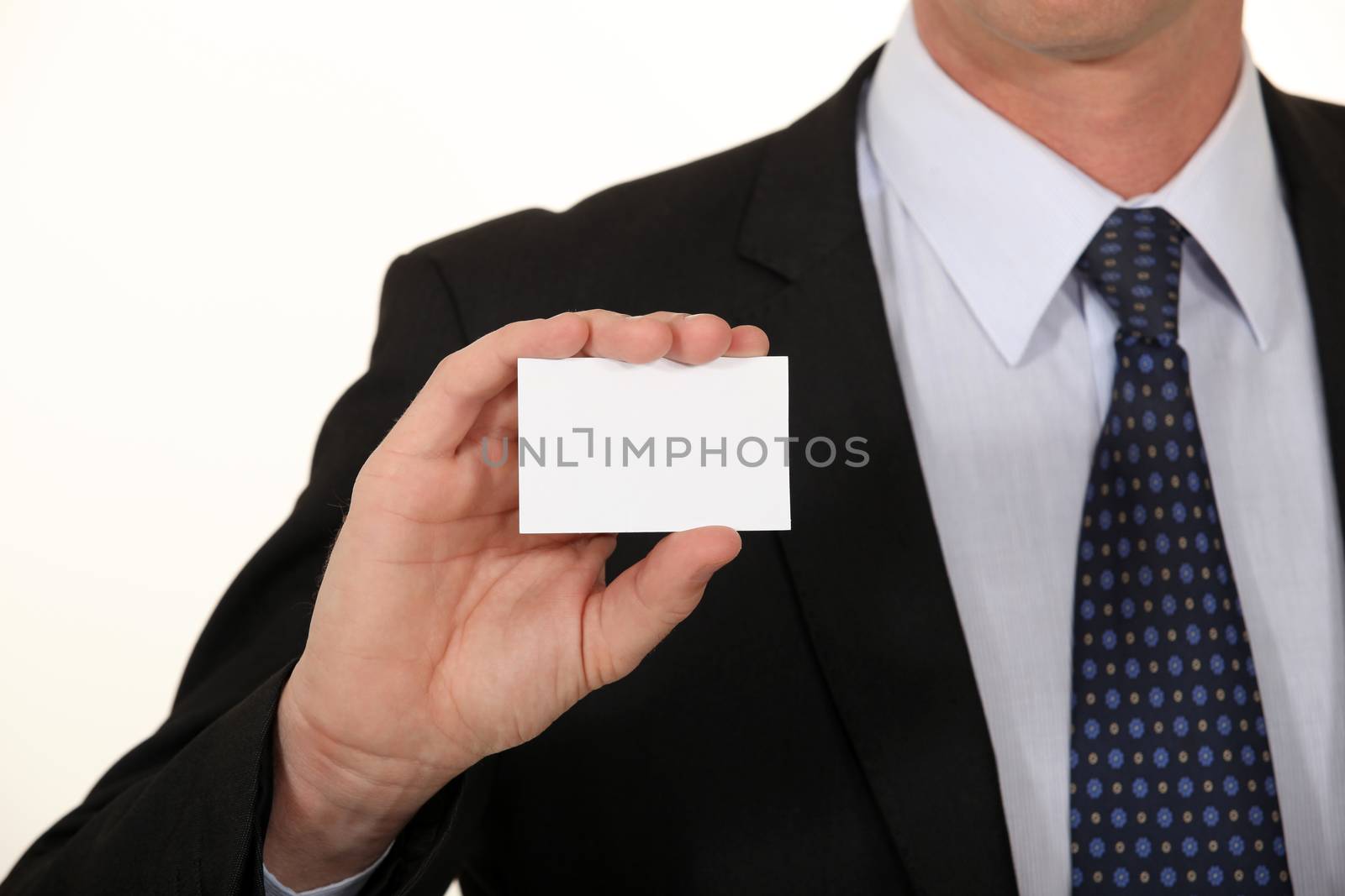 Businessman holding card