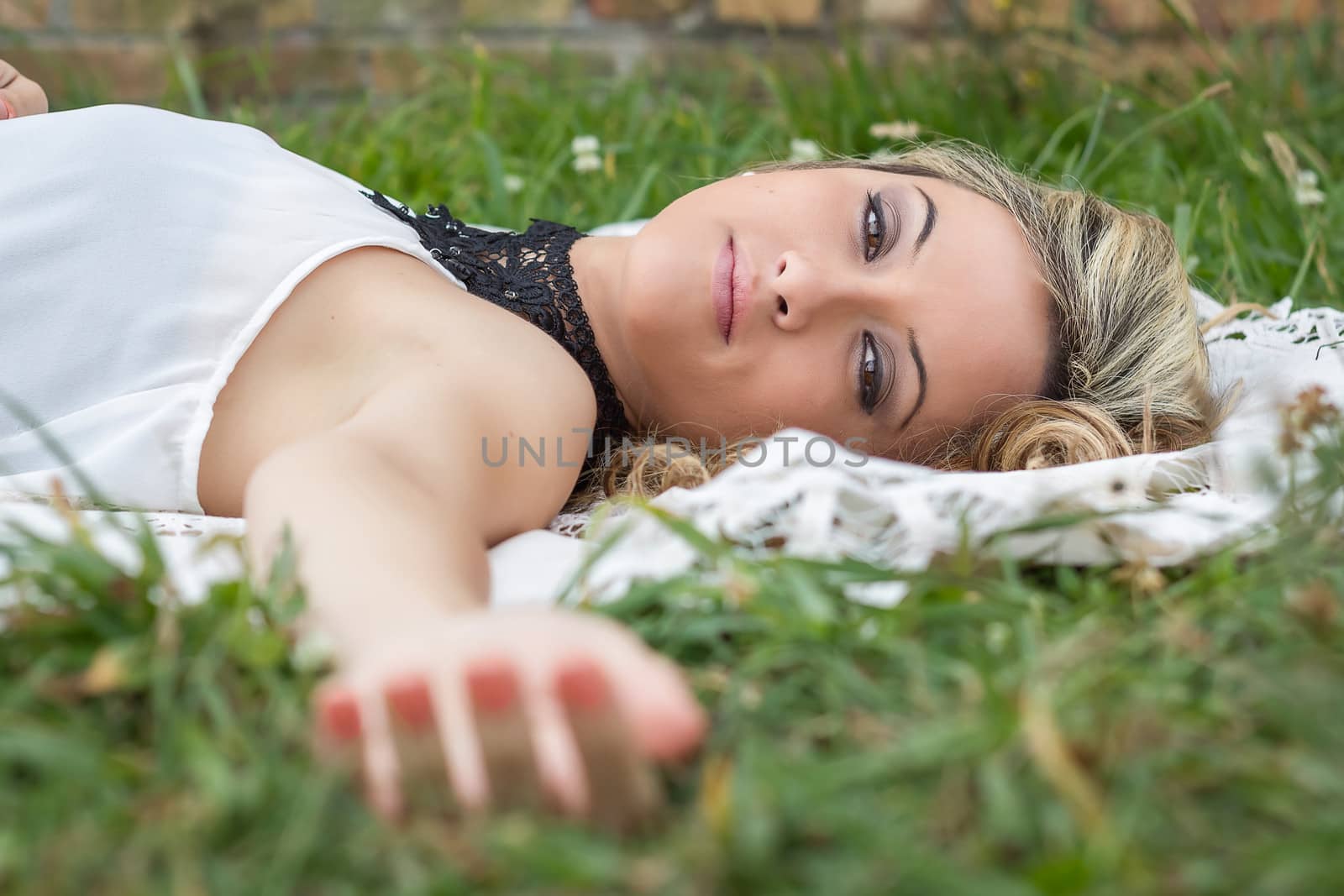 Beautiful girl relaxing on the grass by doble.d