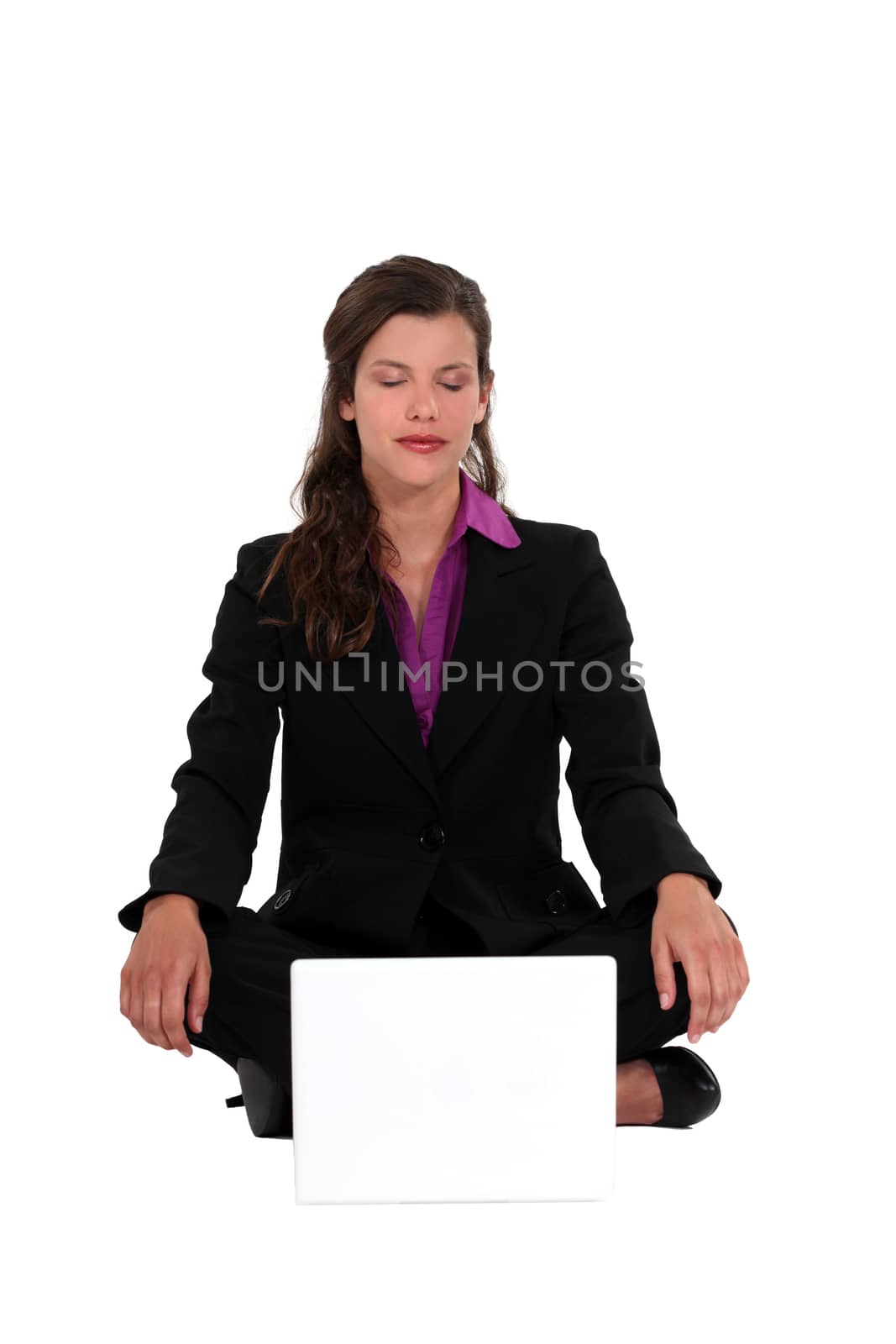 A businesswoman in a lotus position. by phovoir