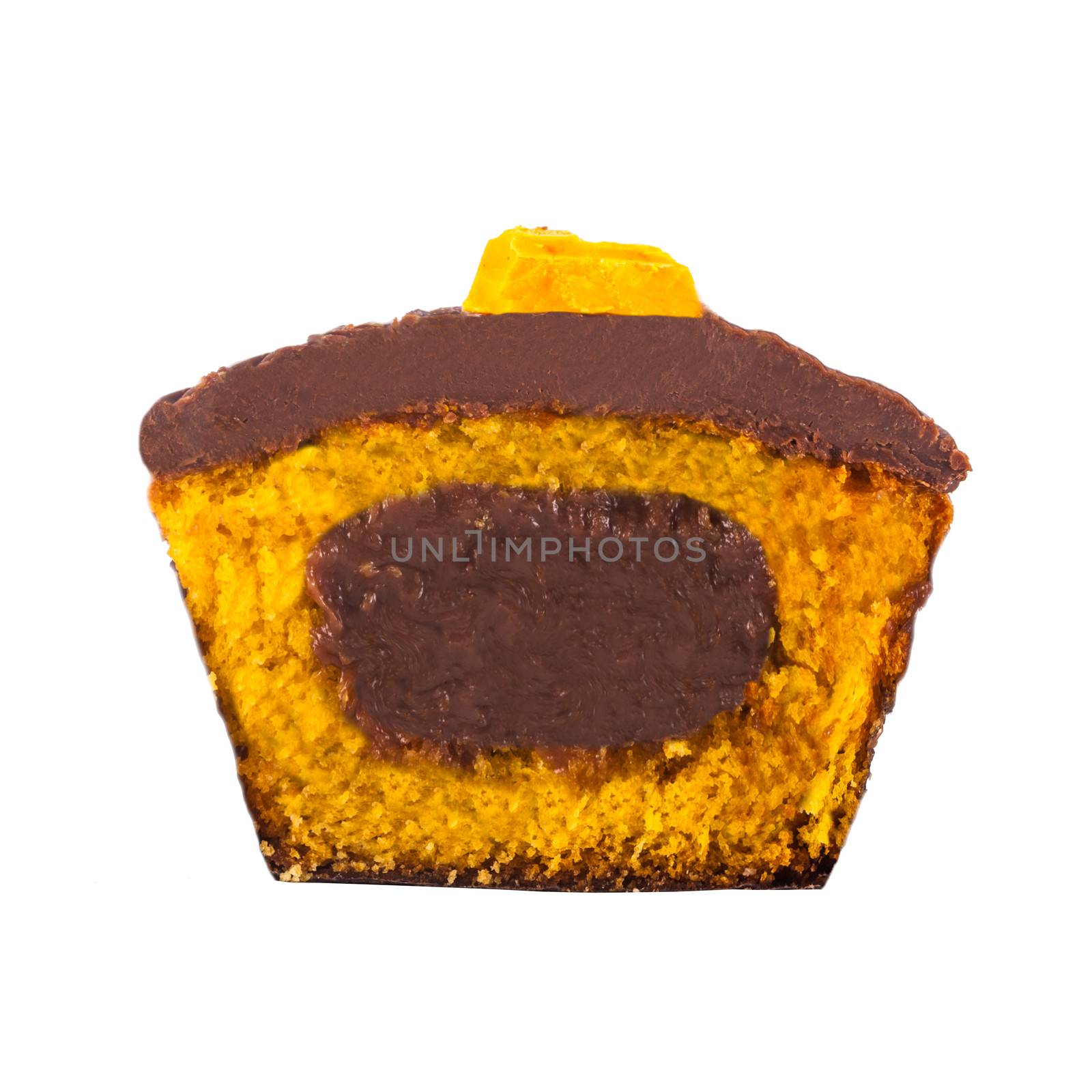 A delicious chocolate and carrot cupcake cut in half isolated on a white background.