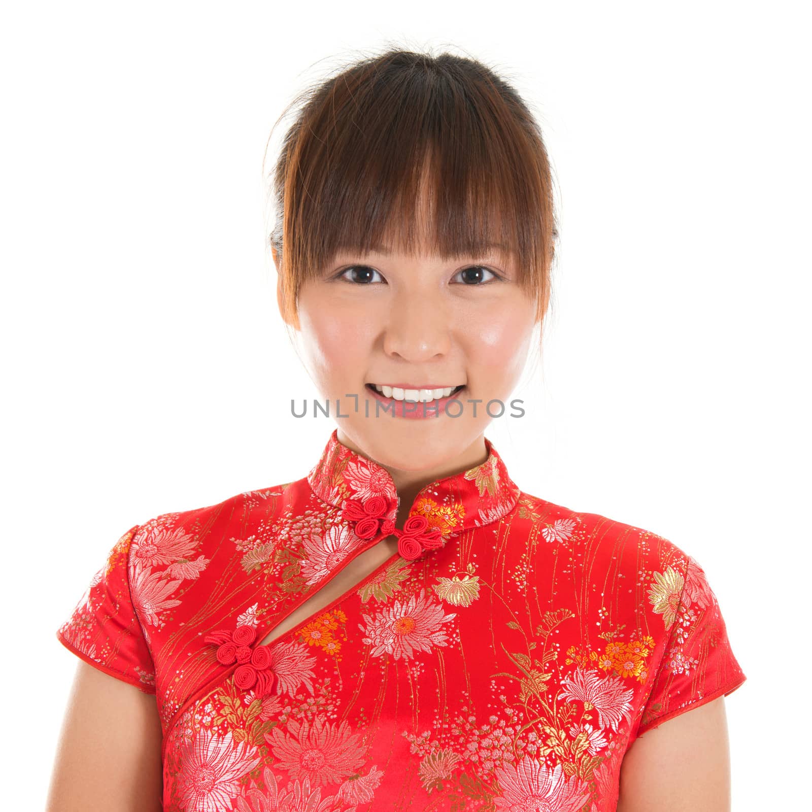 Asian woman with Chinese traditional dress cheongsam or qipao, close up face shot. Chinese new year concept, female model isolated on white background.