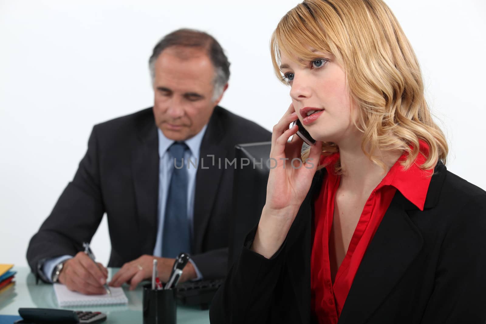 Businesswoman on the phone in office by phovoir