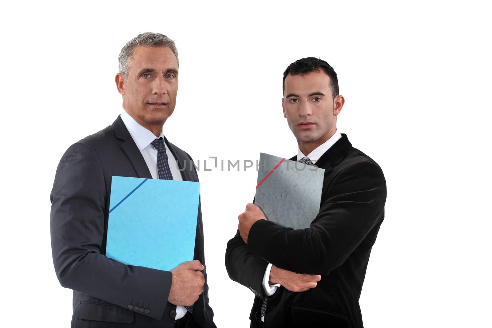 Businessmen holding folders by phovoir