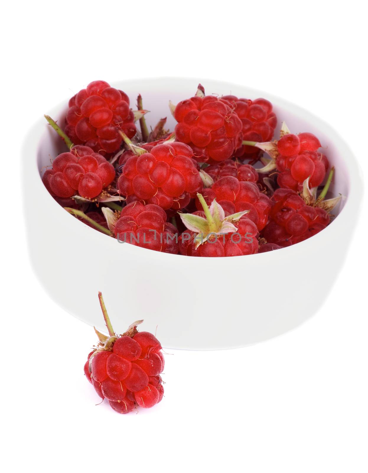 Juicy Raspberries with Fruit Stems in White Bowl isolated on white background