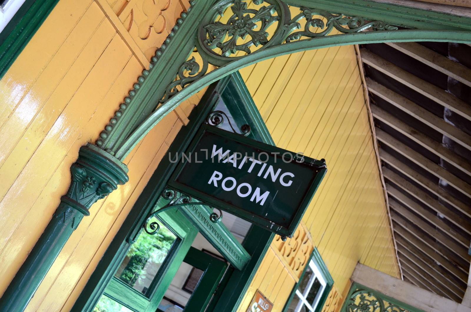 Waiting room sign on Victorian railway station platform by bunsview