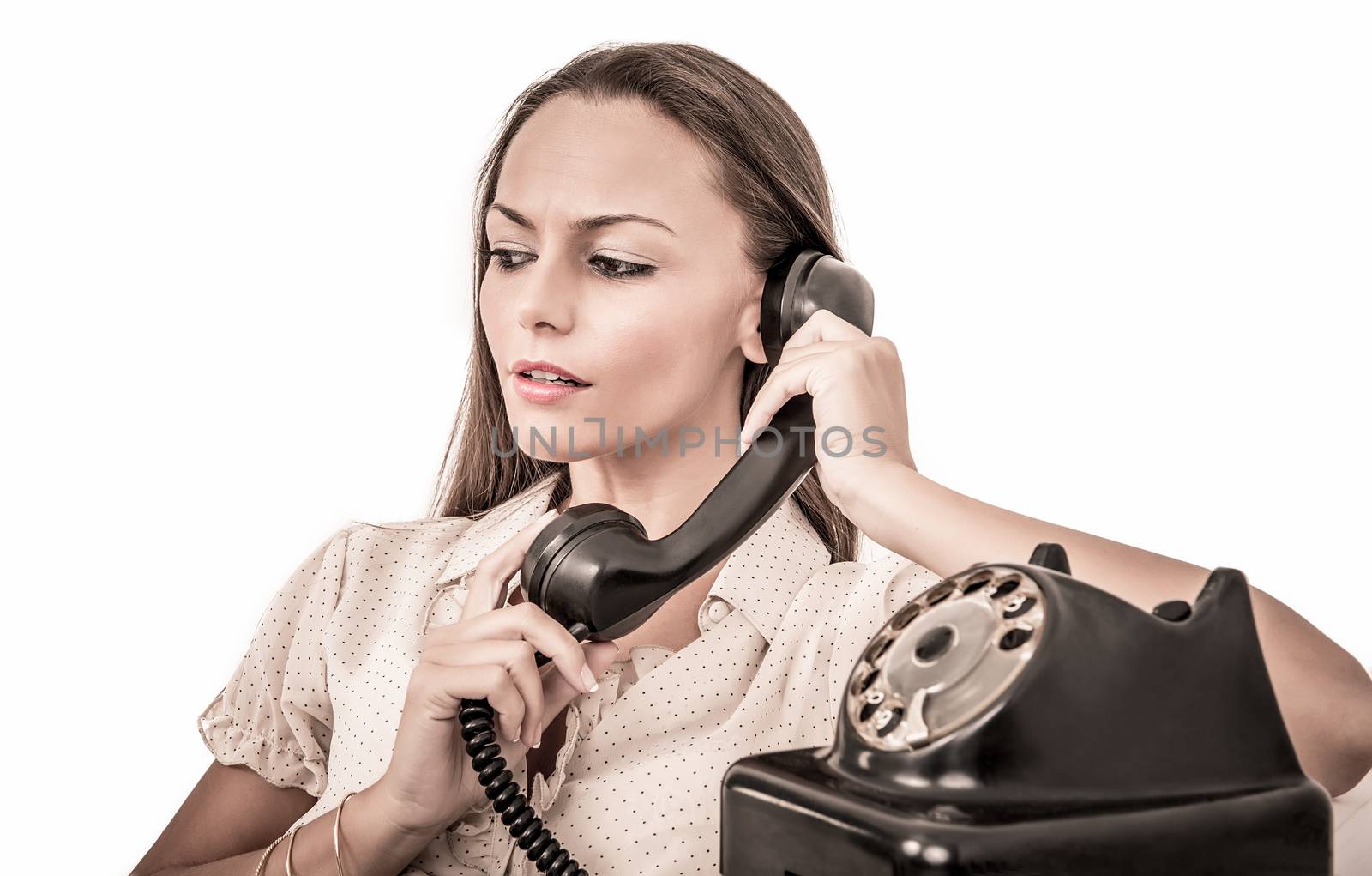Beautiful business woman talking with a vintage phone