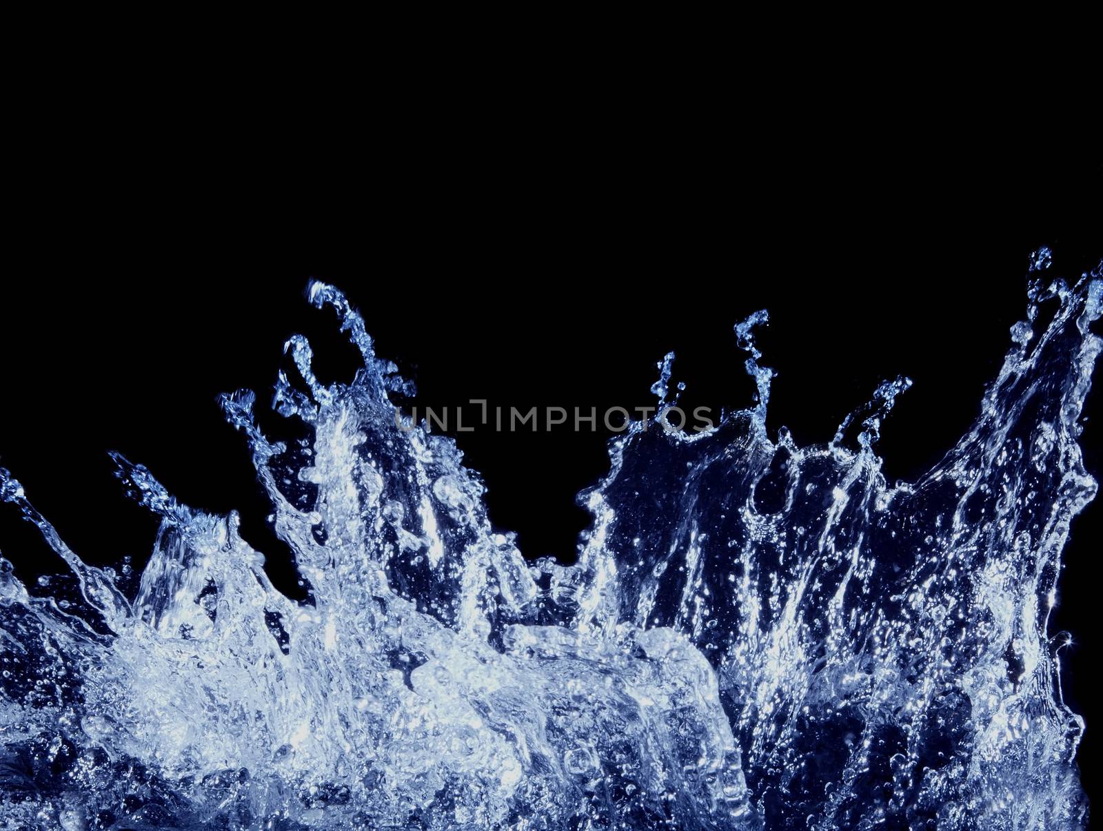 splashing water on black background by khunaspix