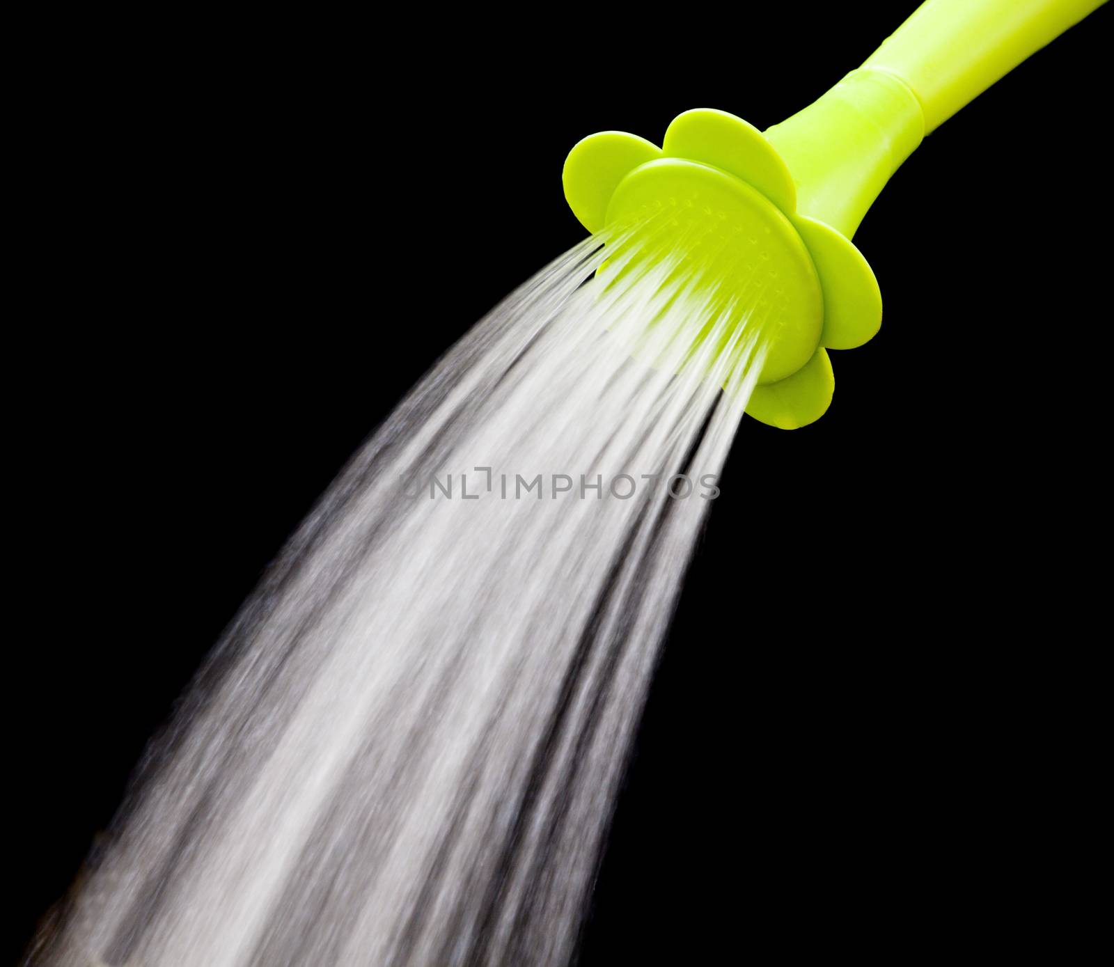 green watering can pouring water with slow speed shutter isolate by khunaspix