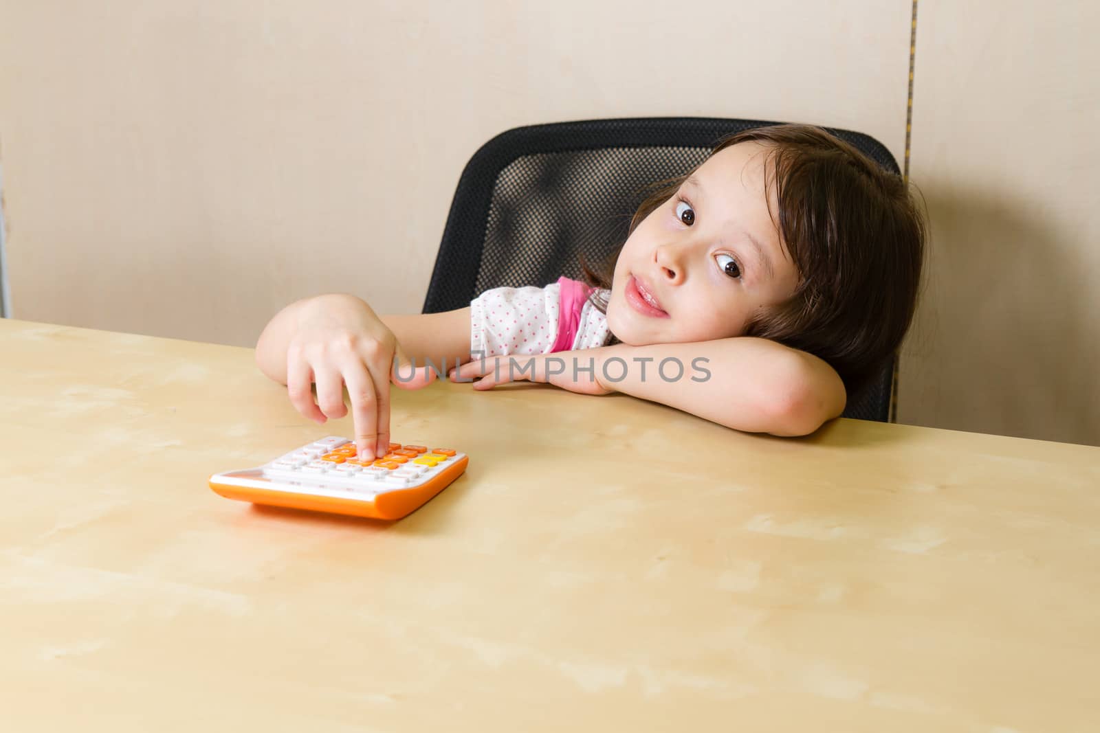 Child with calculator in corporate office