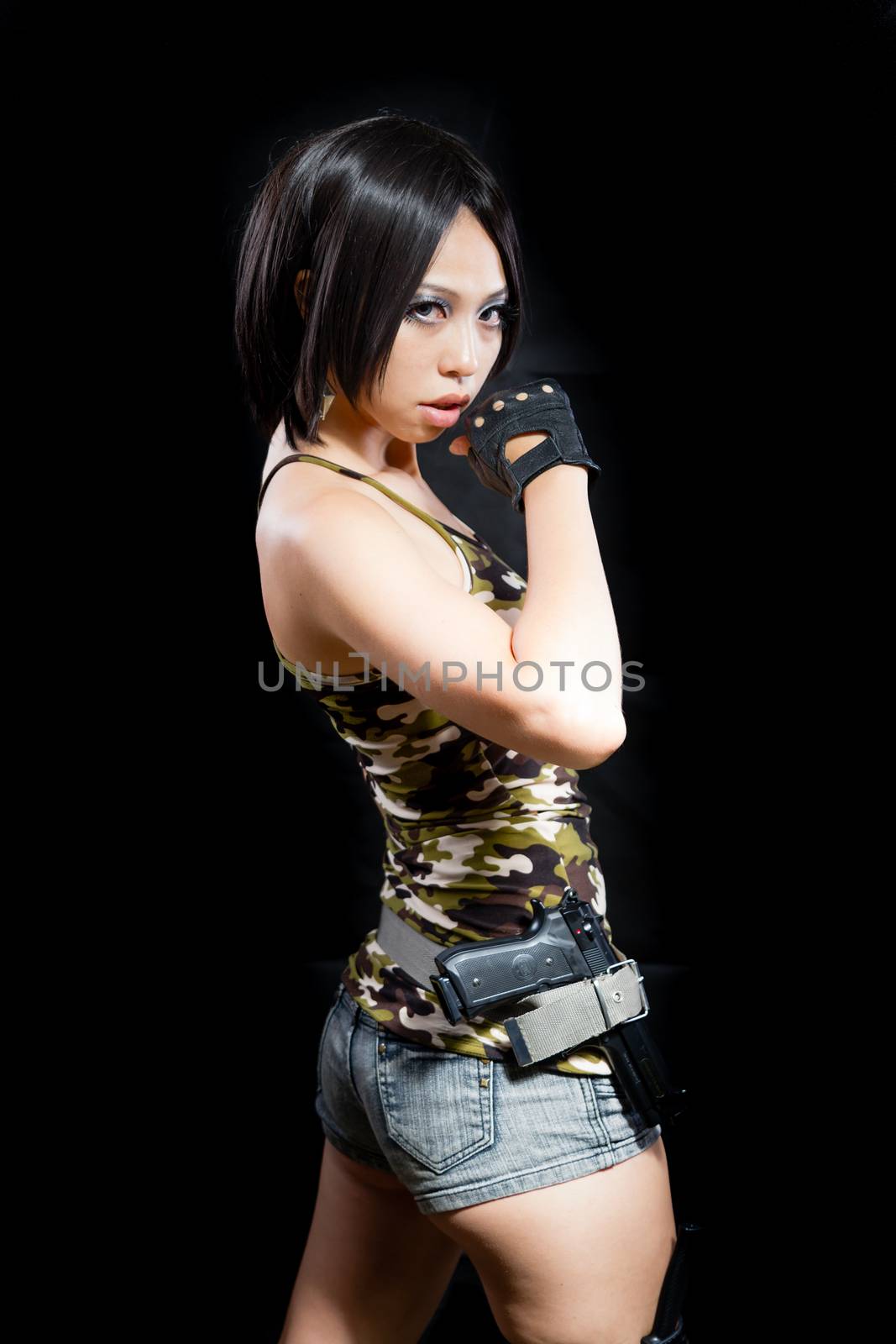 Asian female in army clothing on isolated background