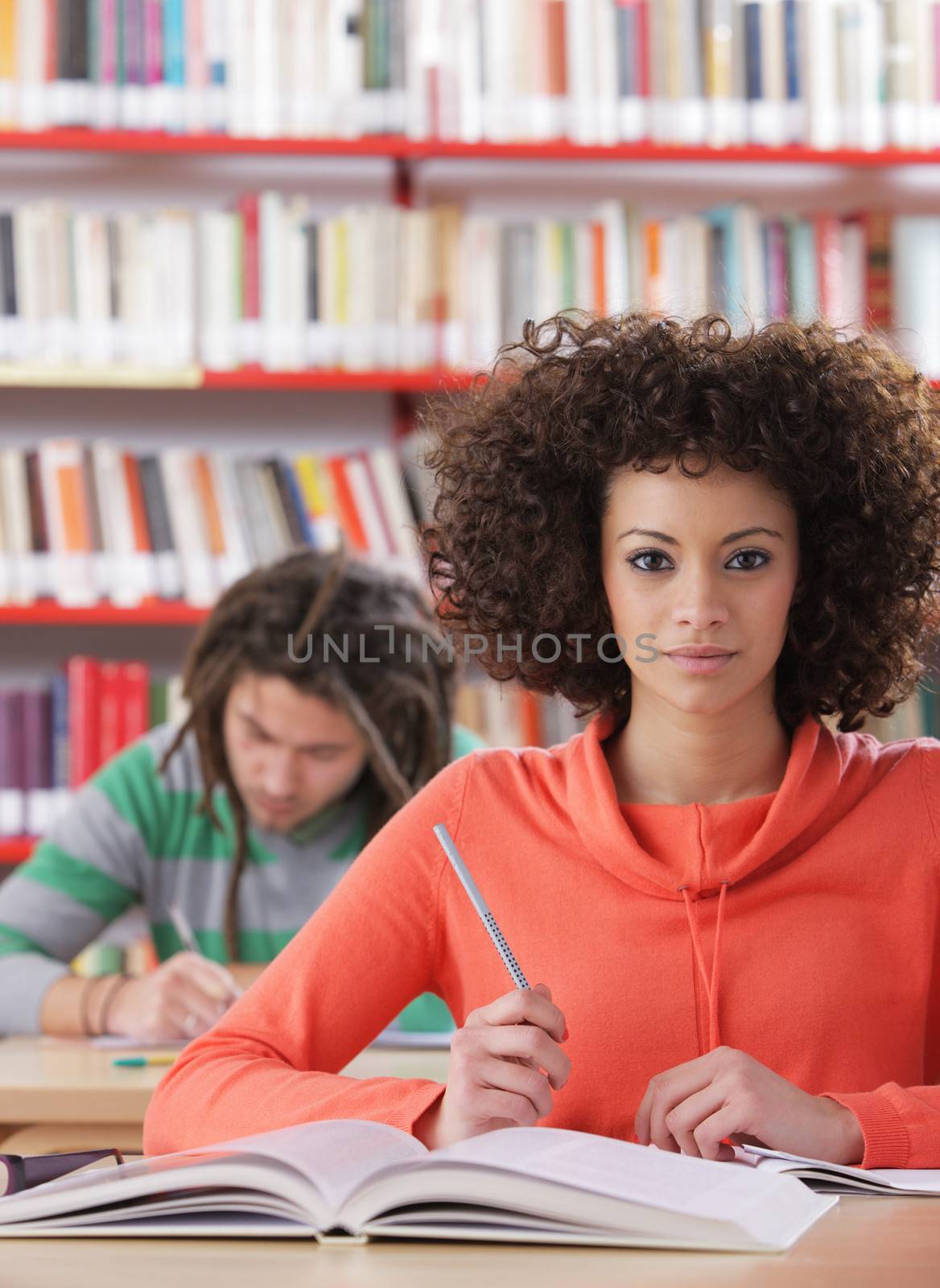 Two students in a library