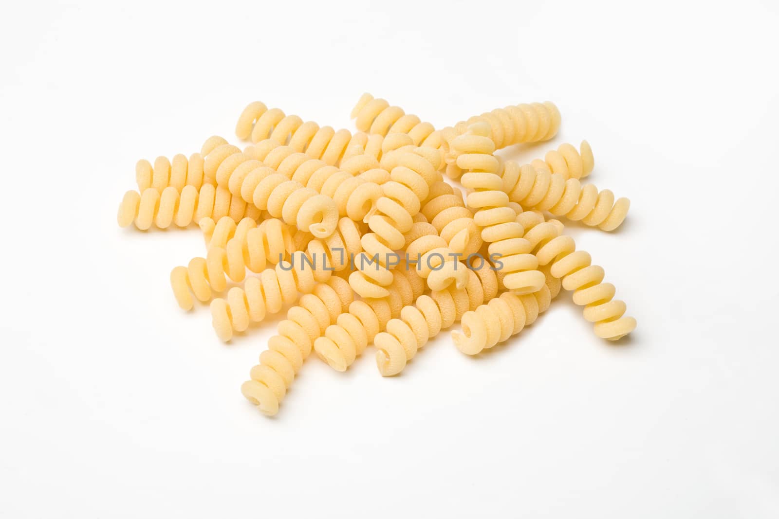 heap of pasta on white background