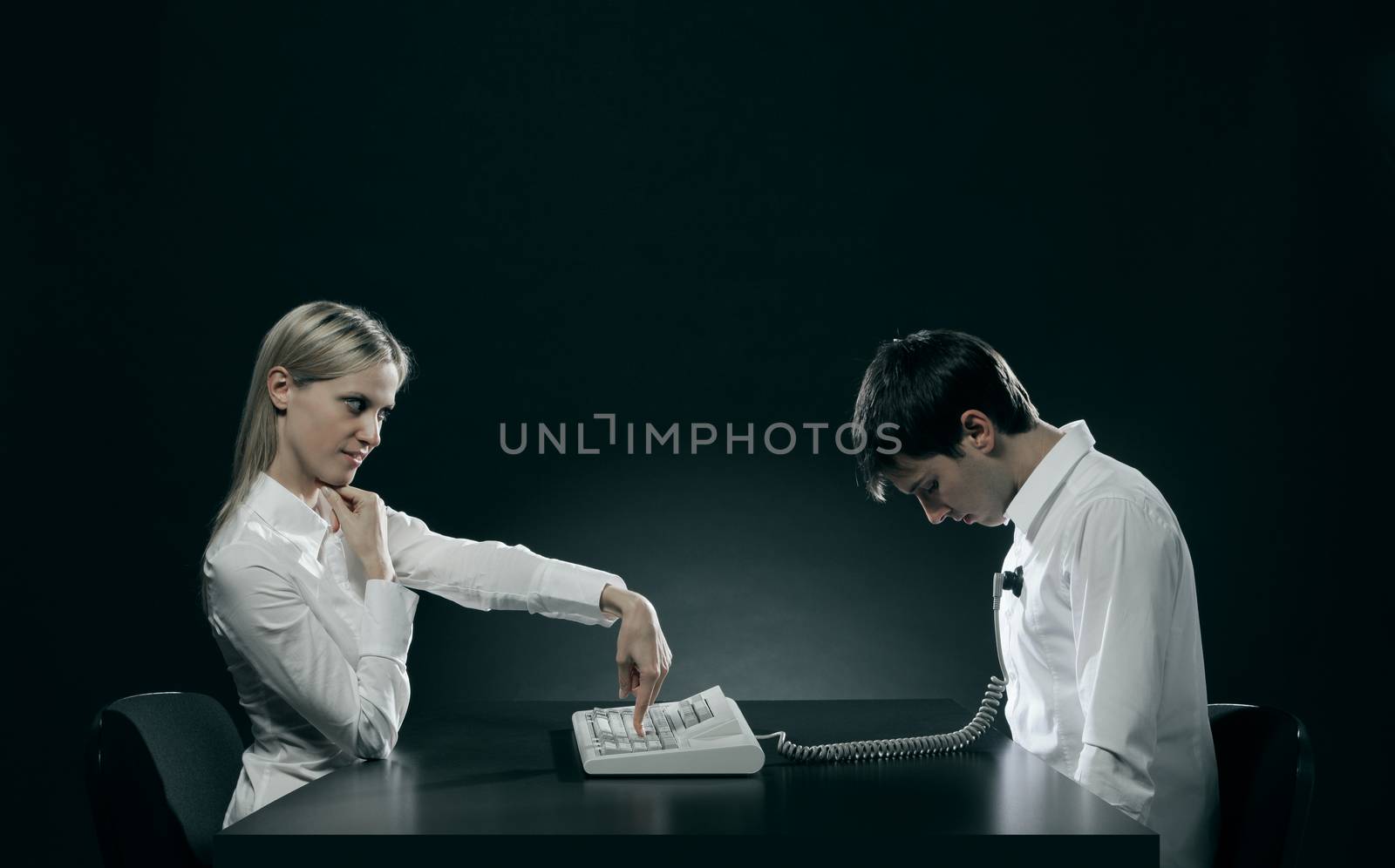 Power of women. Young woman controls her husband with a keyboard