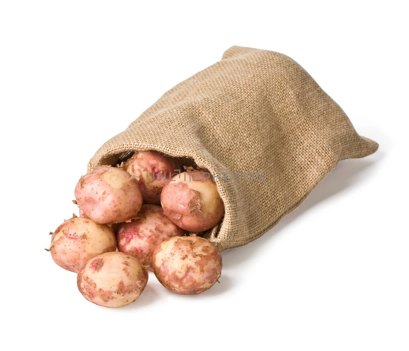 Raw potatoes in a hessian sack isolated on a white background with clipping path