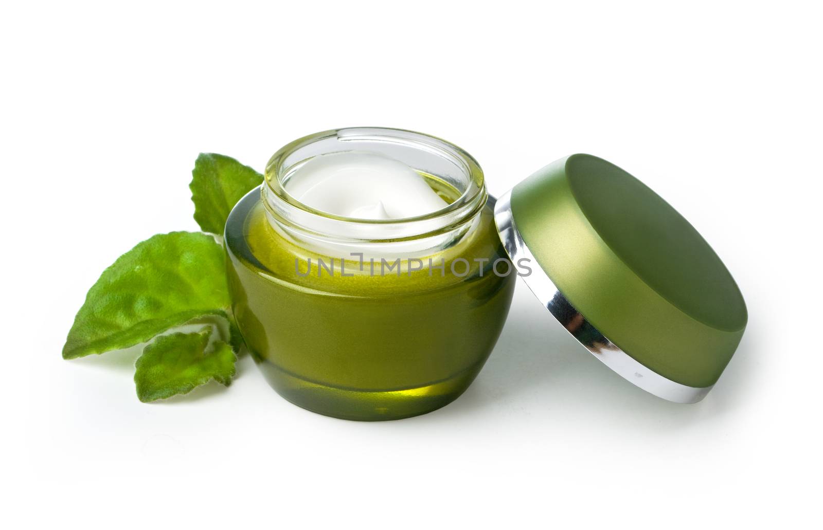 green jar of cream isolated on white background.