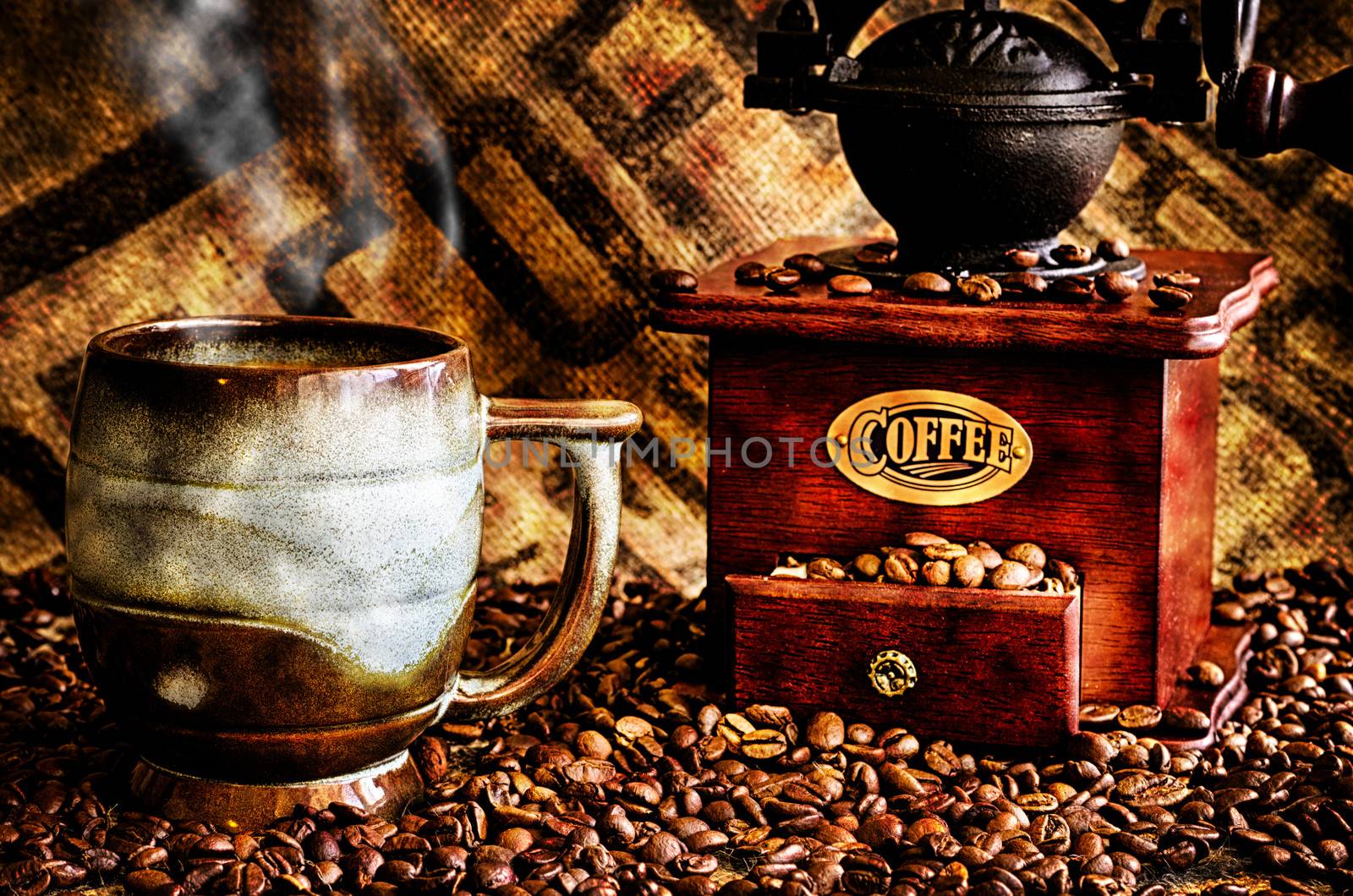 This image is a closeup of a cup of steaming hot coffee with coffee beans, coffee grinder, and coffee beans bag in background.