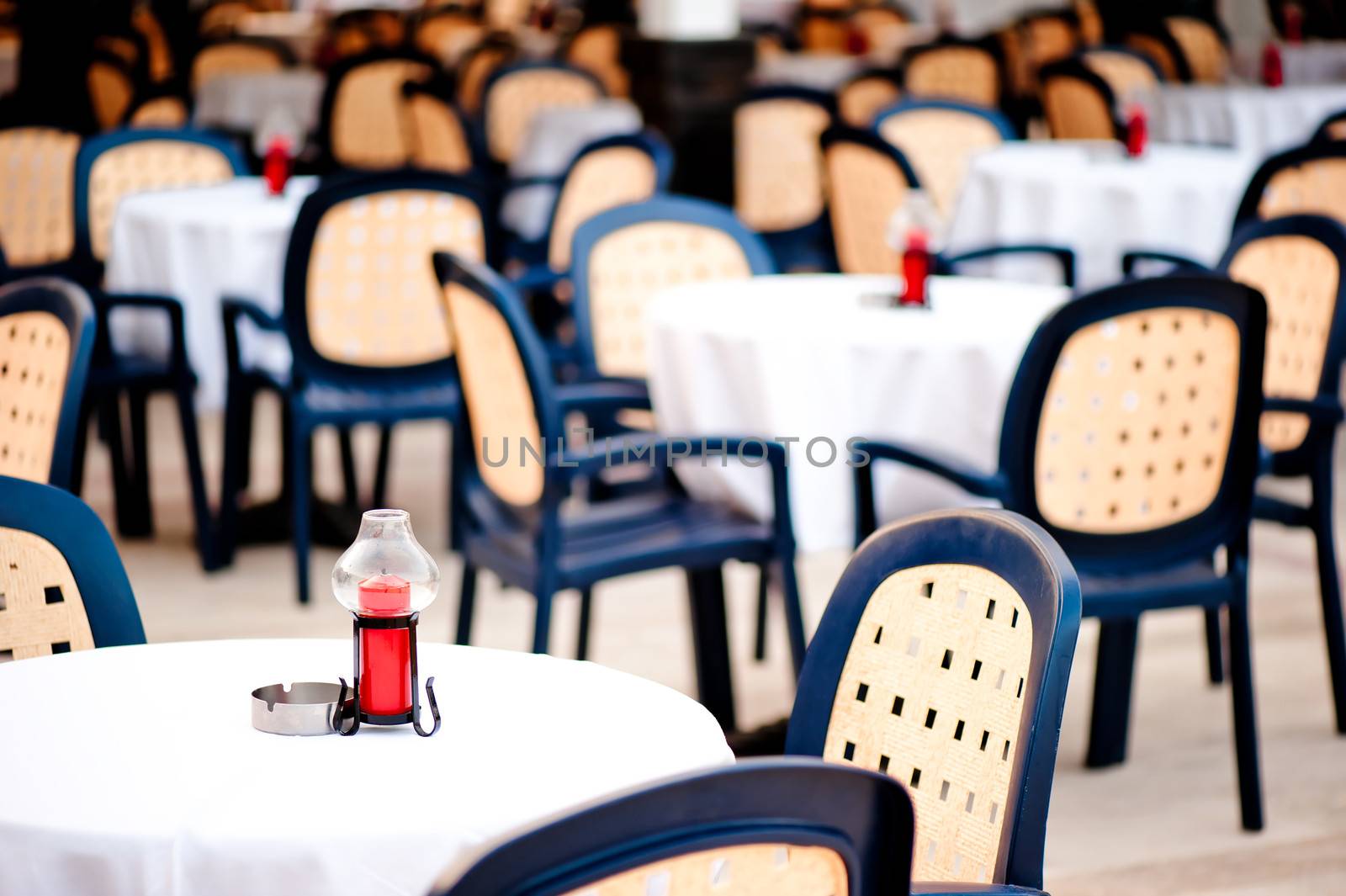 covered with a tablecloth tables for visitors to the summer outdoor cafes