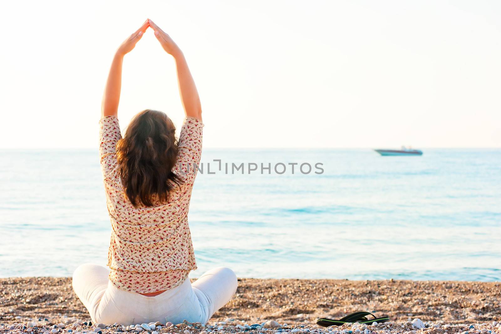 Pilates girl has sat on the beach by kosmsos111