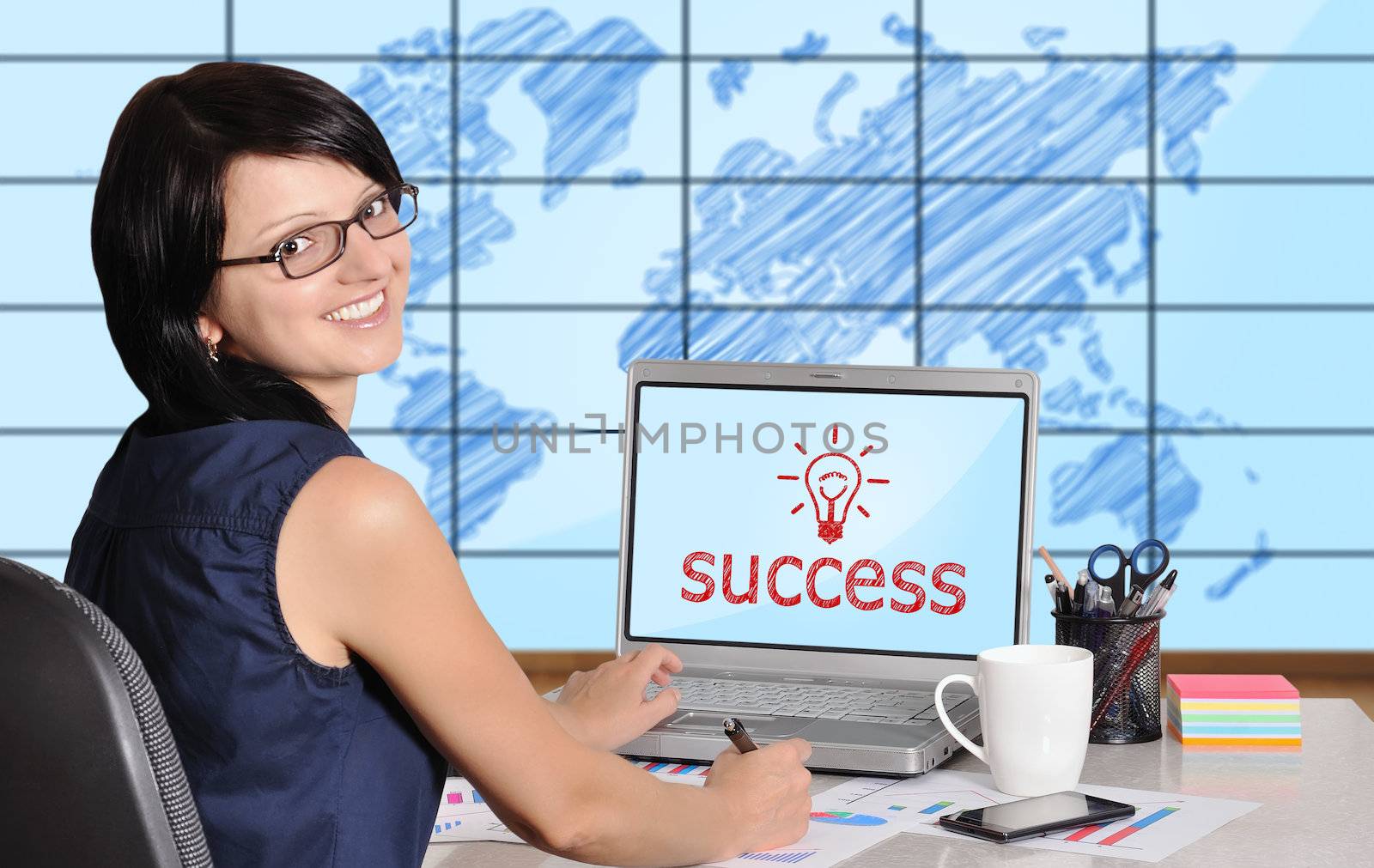 woman with laptop sitting in office, success concept