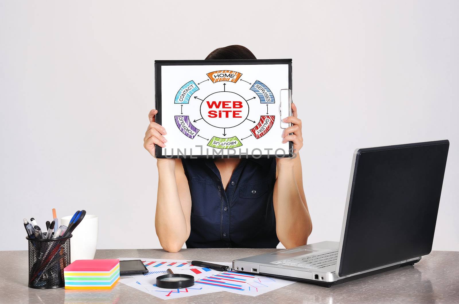businesswoman holding clipboard with drawing  web site scheme