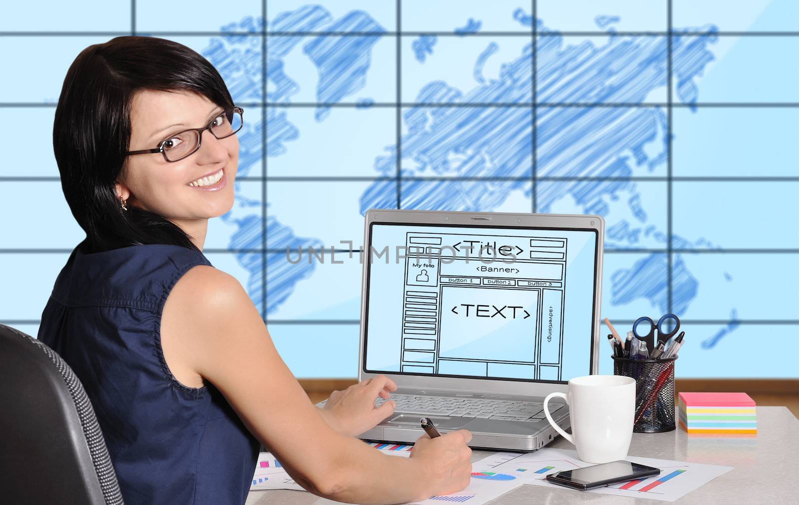 woman sitting in office and web page on screen