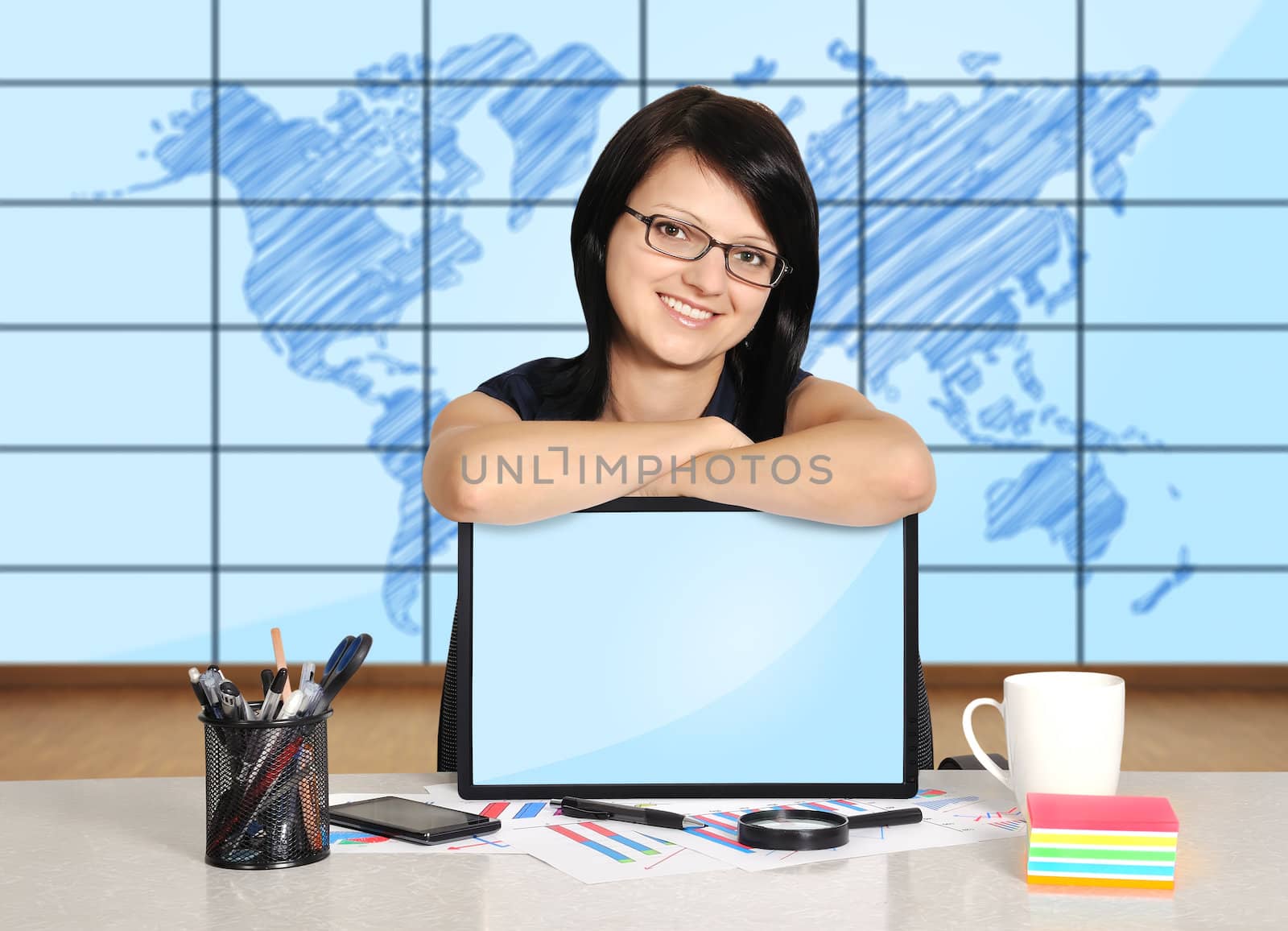 woman with note pad sitting in office