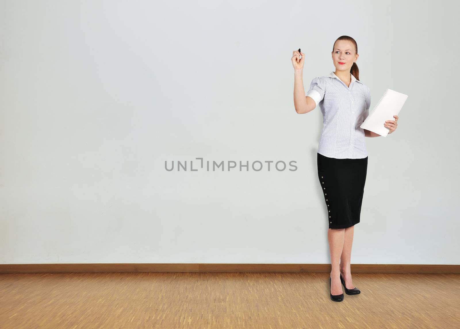 businesswoman standing in office  and drawing