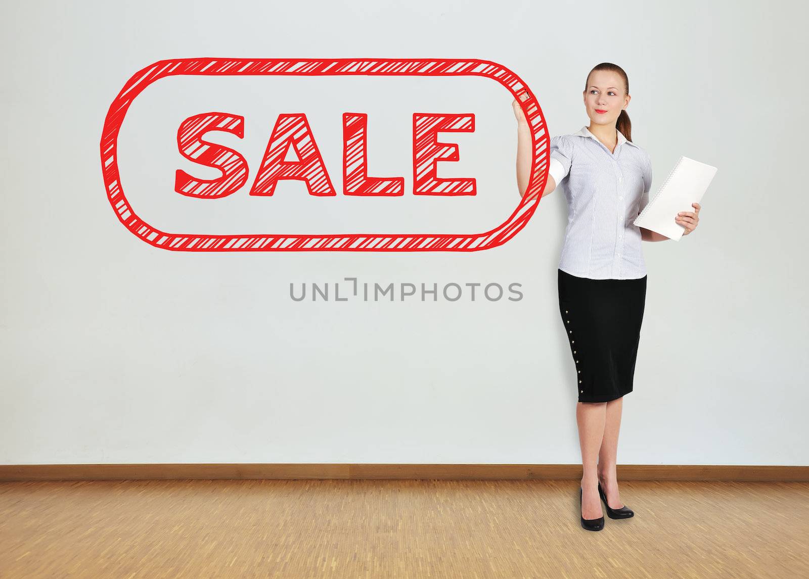 businesswoman in office drawing sale symbol