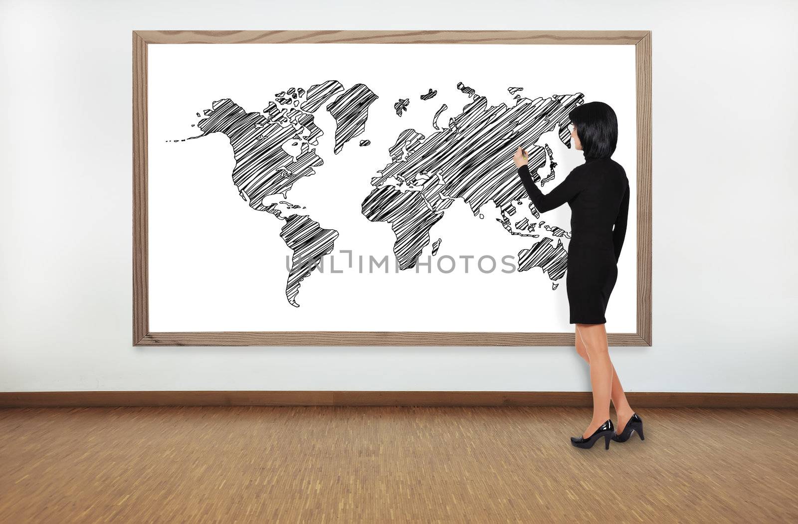 businesswoman drawing worl map on blackboard