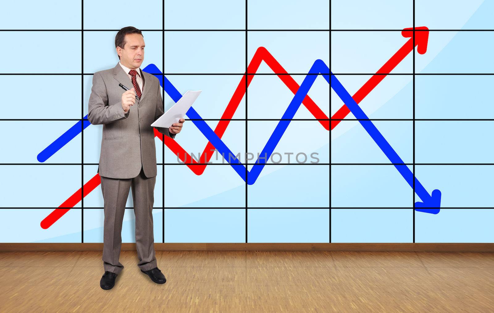 businessman in office and chart on plasma wall