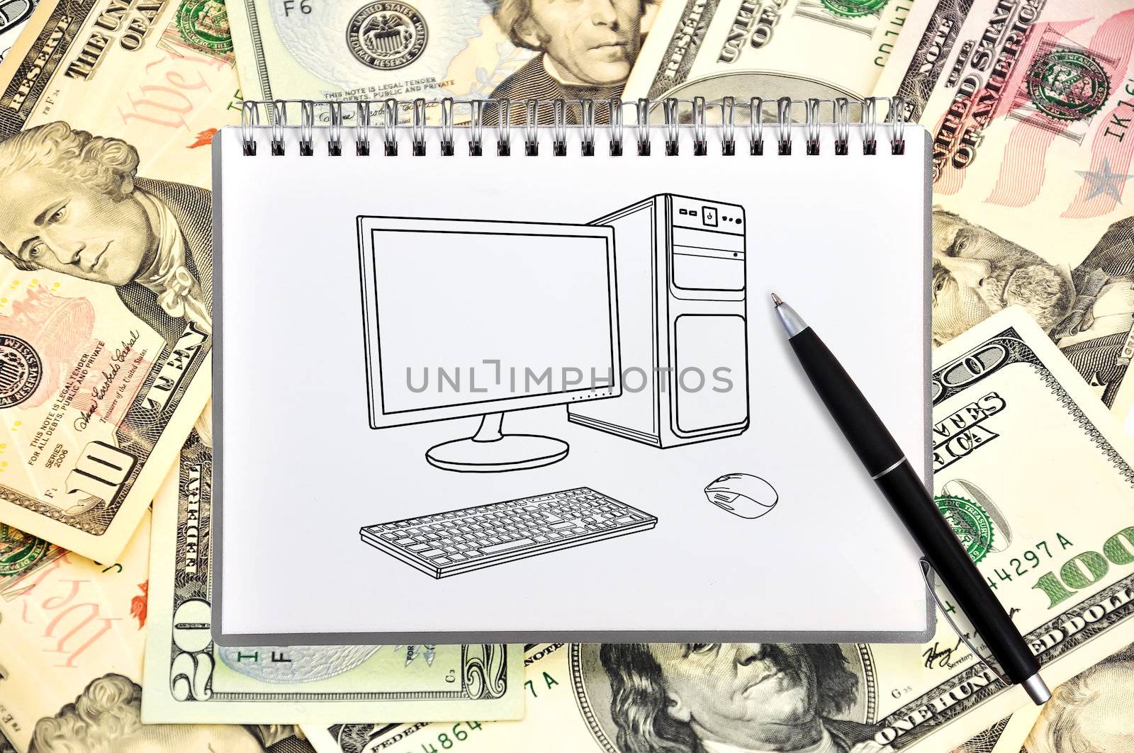 notebook with drawing computer on money background