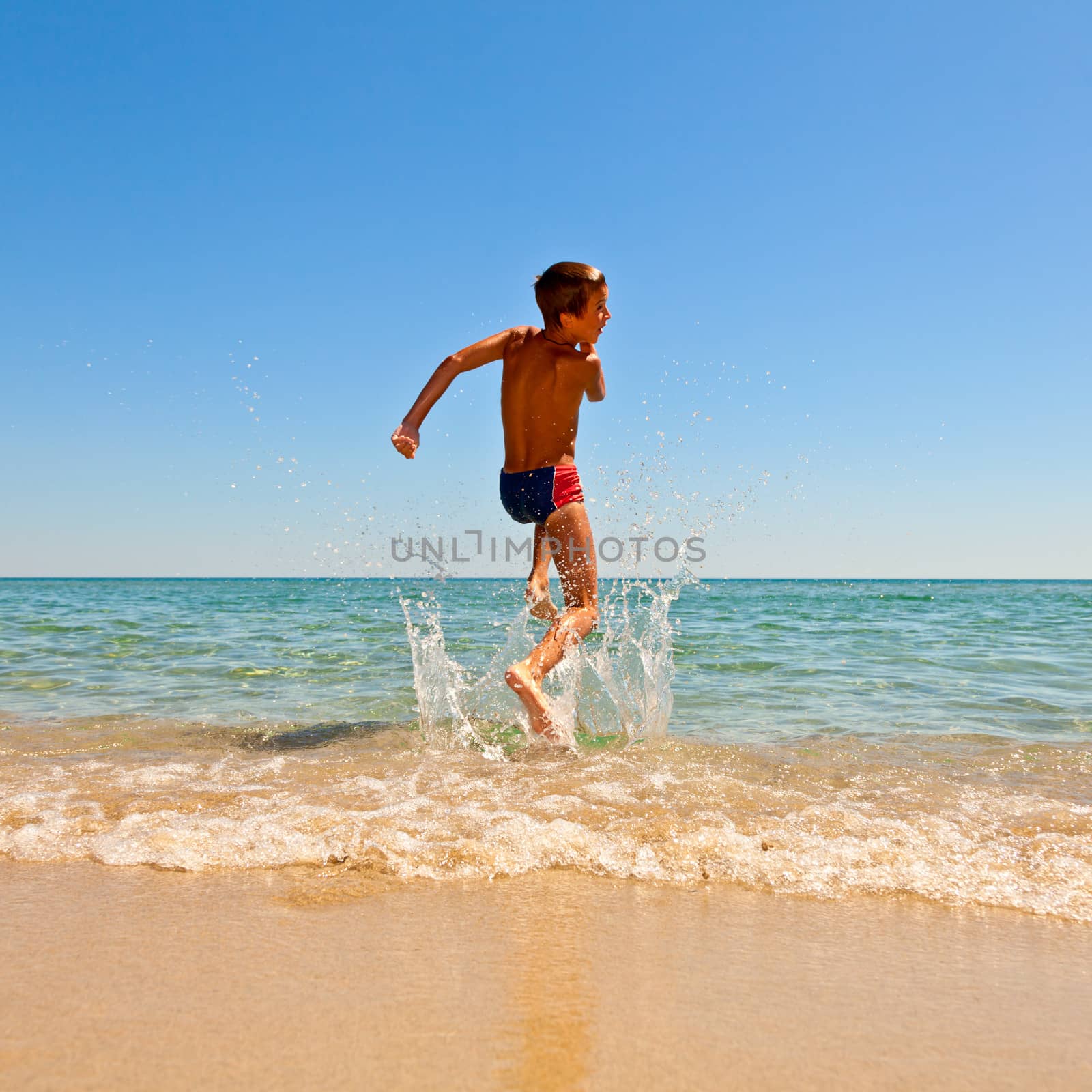 Boy jumping to the sea by naumoid