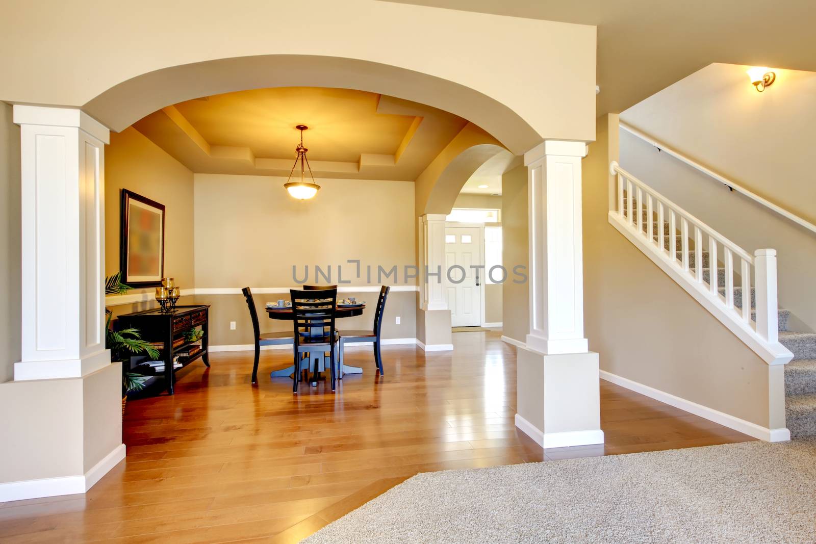 New home dining room interior with hardwood floors and table.