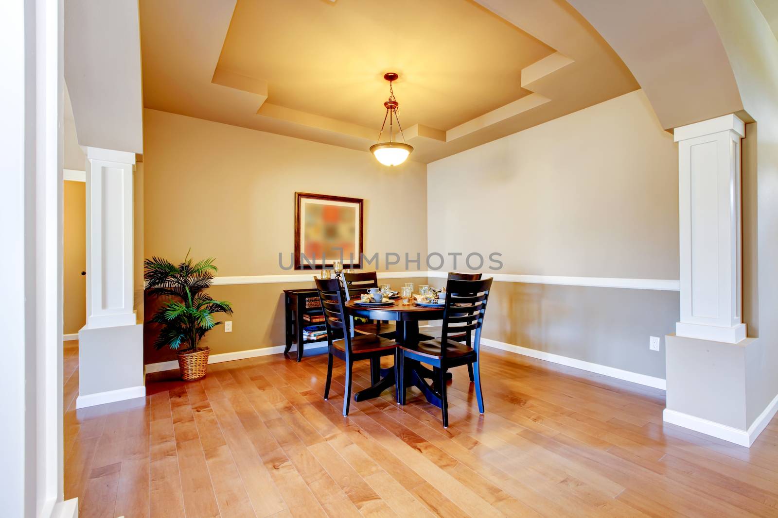 New home dining room interior with hardwood floors and table.