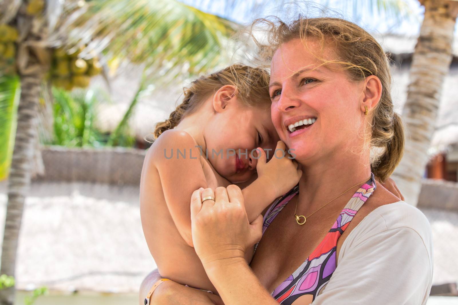 Mother and daughter close to each other outside having fun time